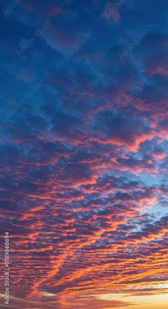 Fototapeta premium A breathtaking natural display as the sun sets, illuminating the vast blue sky with vibrant pink and fiery orange clouds ,purple ,amazing ,sunlight