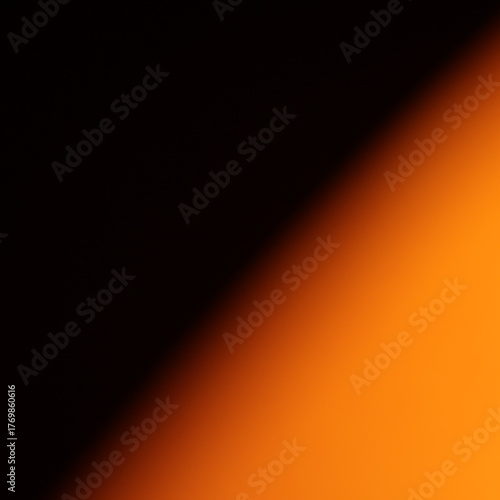 Una toma de cerca de un fondo abstracto de colores anaranjado  y negro con un degradado ligero desenfocado
