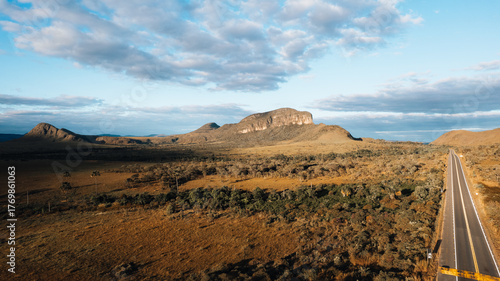 Morro da Baleia aerial view, Chapada dos Veadeiros, mountains, green fields with buritis, Jardim de Maytrea, Alto Paraiso de Goias at golden hour sunset