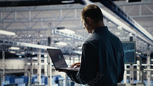 Wallpaper Mural Data center engineer adjusts system settings to improve AI rigs processing speed and efficiency. Server hub employee manages infrastructure to support artificial intelligence workloads, camera B Torontodigital.ca