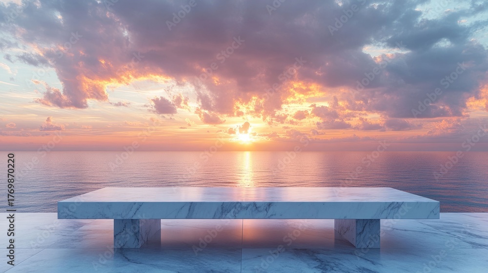 Fototapeta premium Majestic marble table set against a breathtaking sunset over the serene ocean creating a peaceful and elegant backdrop for product showcasing or lifestyle imagery