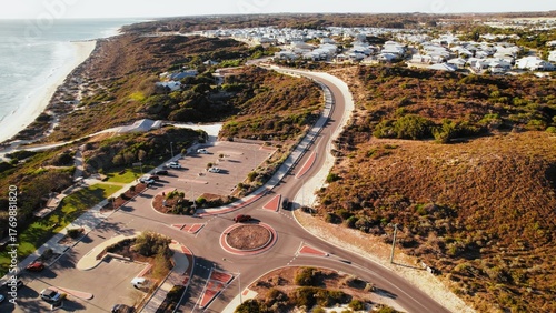 Wallpaper Mural Scenic view of coastal roundabout with parking area near the beach during sunny daytime Torontodigital.ca