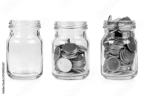 Set of money in glass jar isolated on white background.