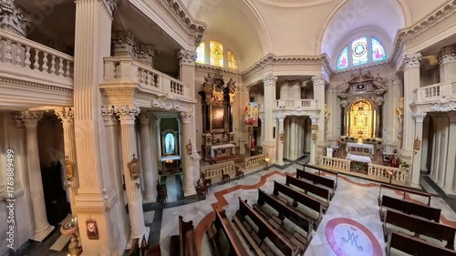 Modena, Italy - Oct 25, 2025: Baroque architecture filling the Sanctuary of the Blessed Virgin Helper of the Modenese People, featuring ornate columns and an altar. 360 top view of St George church