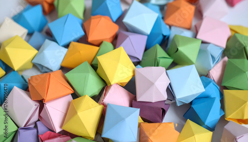 A texture made up of many colorful, three-dimensional origami accessories