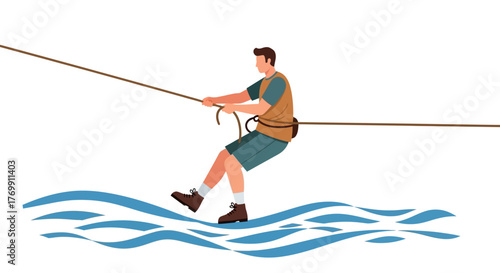 Man in vest pulls rope above water boots wet