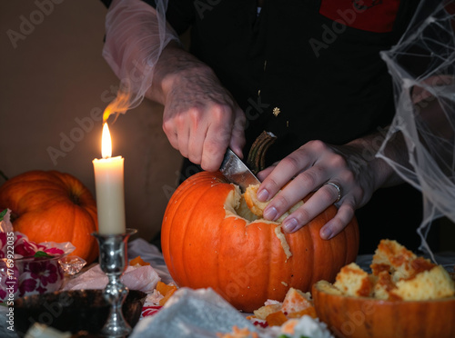 Carving a Halloween Pumpkin by Candlelight