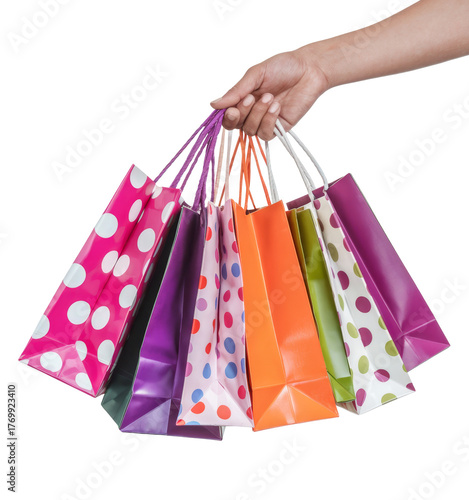 hand holding colorful shopping bags on white background