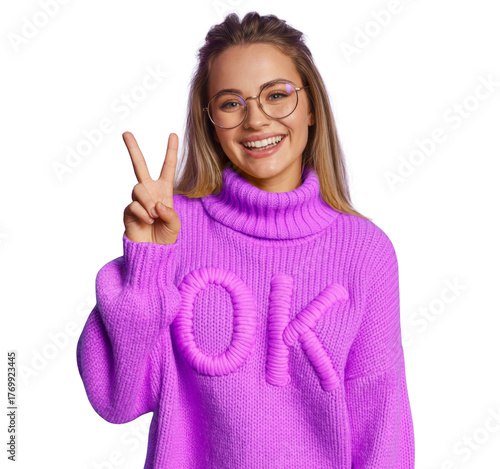 happy woman making a peace sign with ok sweater.