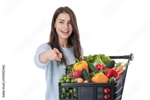 smiling woman with shopping cart full of fresh produce