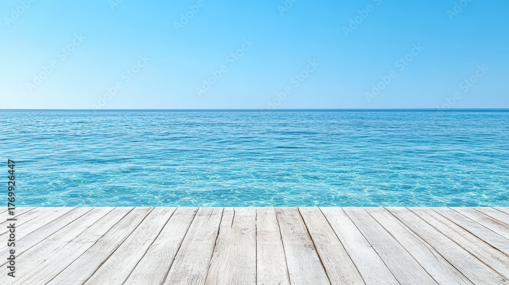 Fototapeta premium Serene ocean view with clear blue water and wooden deck under bright sky