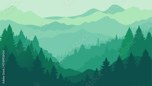 Misty green mountain range with evergreen forest silhouette