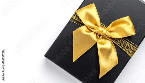 Wallpaper Mural Presents luxurious gift. Golden ribbon adorns the dark box on a white surface. Use for marketing, design, and web content. Torontodigital.ca
