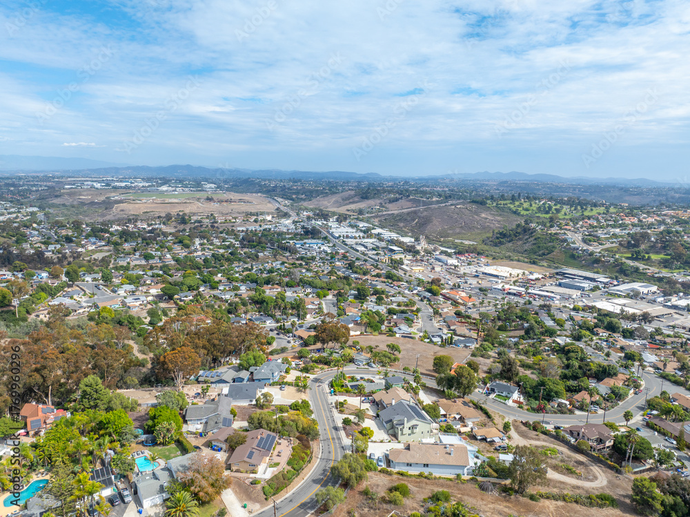 Naklejka premium Aerial view of middle class houses in the valley of Oceanside town in San Diego, California. USA.