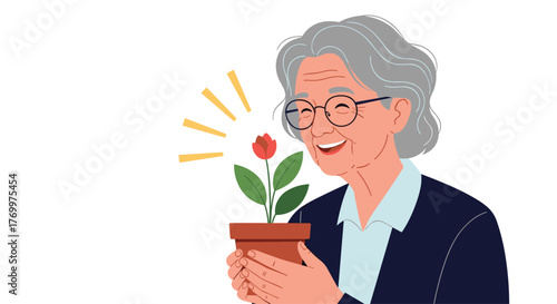 Joyful senior woman with grey hair and glasses, admiring a vibrant potted red flower, radiating happiness.