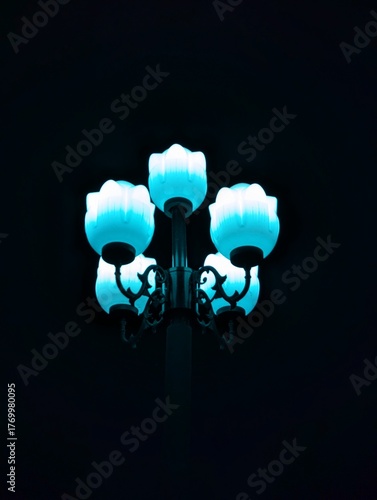 Blue glowing street lamp at night