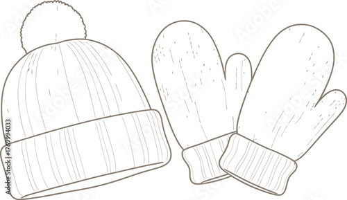 Knitted winter hat with pompom and matching mittens on a soft cream background