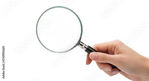 Hand holding magnifying glass for inspection isolated on transparent background