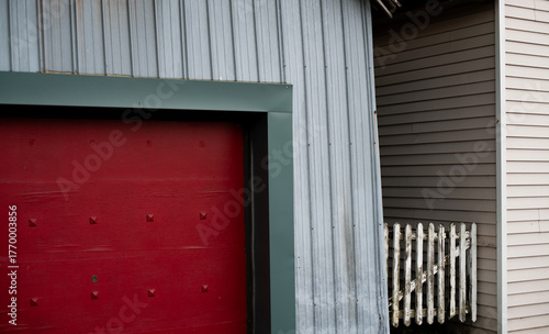 old red door and white picket fence