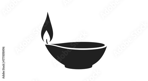 A simple black silhouette of a traditional oil lamp with a flickering flame representing light and tradition silhouette