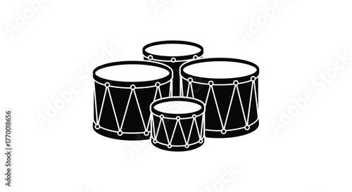A group of four drums in varying sizes arranged closely together in a silhouette style