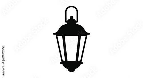 A classic dark black silhouette of an old fashioned hanging lantern with a handle against a white background