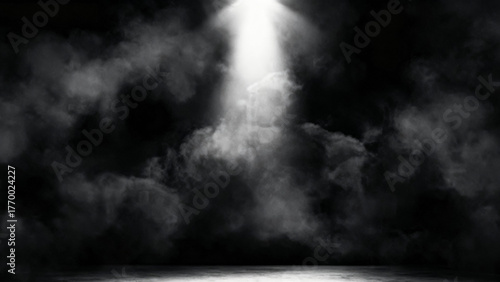 Dramatic spotlight beam cutting through thick dark smoke and fog creating an atmospheric and mysterious scene