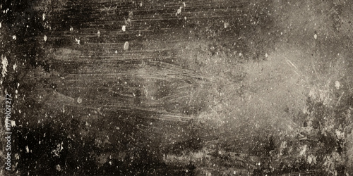 panoramic image of a highly textured and distressed surface, likely an old concrete or plaster wall shadowy blacks, deep browns, and faded sepia or beige tones.