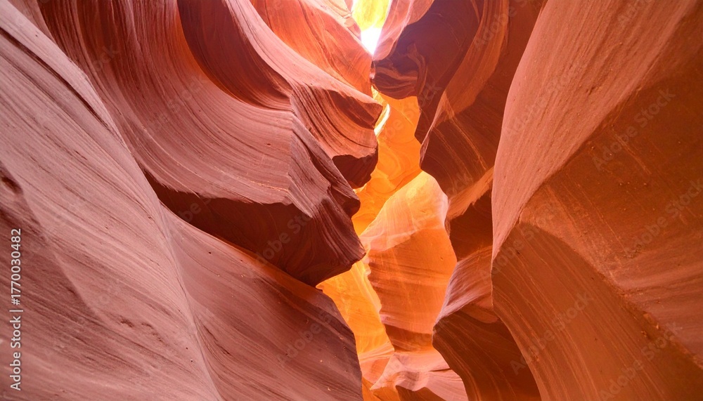 Obraz premium Explore the mesmerizing depths of Antelope Canyon with its smooth sandstone walls and the ethereal glow of natural light, a vibrant showcase of nature's artistic power and geological wonder
