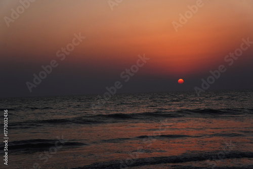 Sunset over the sea with orange sky