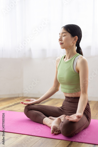 Free Download Japanese Woman Meditating in Living Room with Natural Light - GFXLoad