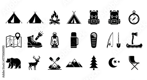Set of solid black glyph icons representing camping equipment, hiking gear, and wildlife for outdoor adventure and wilderness exploration