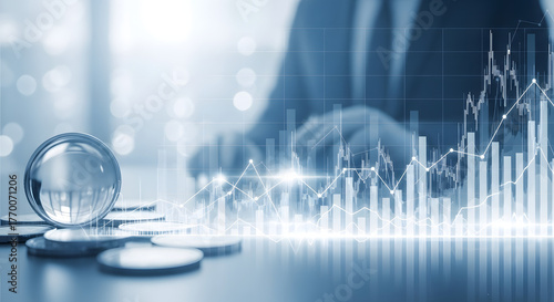 Businessman analyzing financial data with crystal ball and coins in the foreground