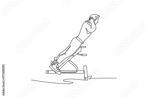 Continuous one line drawing young man doing hyperextension or back extension exercise on roman chair, focused lower back strength and core training. Single line draw design vector graphic illustration