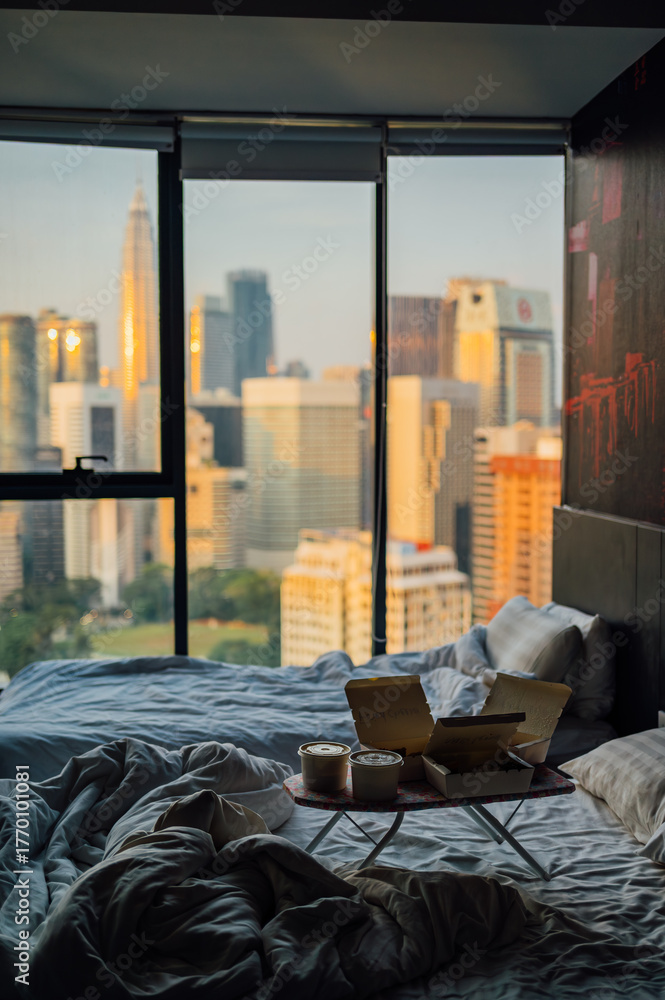 Fototapeta premium Takeaway Breakfast in Bed with Kuala Lumpur Skyline View, Malaysia