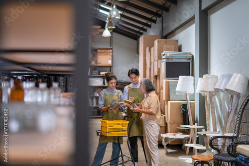 Mother, son and daughter are working at their DIY store.