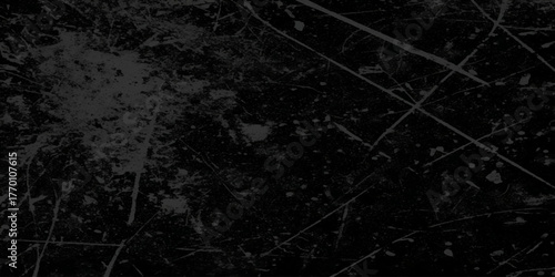 Abstract grunge and grainy old stained and scratched dusty Black Texture with Fine Scratches and Dust. Old black toned grunge rough scratched textured wall, Empty surface of Black stone or grunge.