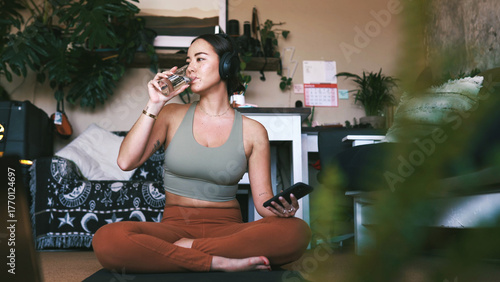 Wallpaper Mural Drinking water, yoga and exercise with woman, smartphone and hydration with fitness. Home, break and healthy person with cellphone, thirsty and liquid with wellness, detox and rest with internet Torontodigital.ca
