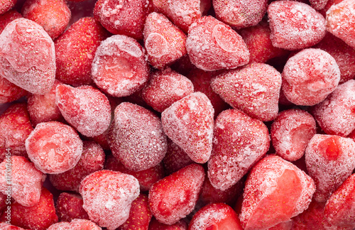 Pile of frozen strawberries for a background. Top view shot