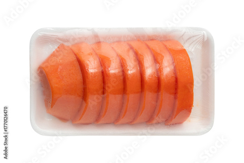 Freshly sliced ripe papaya pieces in plastic wrap on foam tray isolated on a transparent background