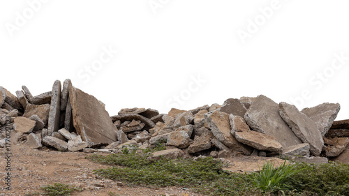 Close-up low angle view isolate of concrete debris, removed from road demolition and dumped on the ground, commonly seen in rural Thai road construction.