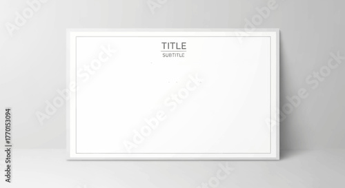 A minimalist white rectangular frame with "TITLE" and "SUBTITLE" text, leaning against a light grey wall.