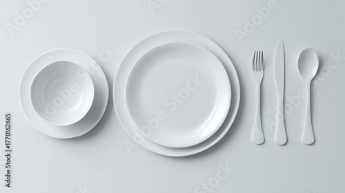 clean white kitchen table with plate and cutlery 