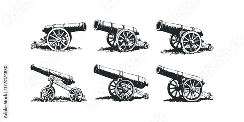 Six vintage cannons on wheels displayed on grass