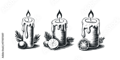Three lit candles with melting wax and foliage