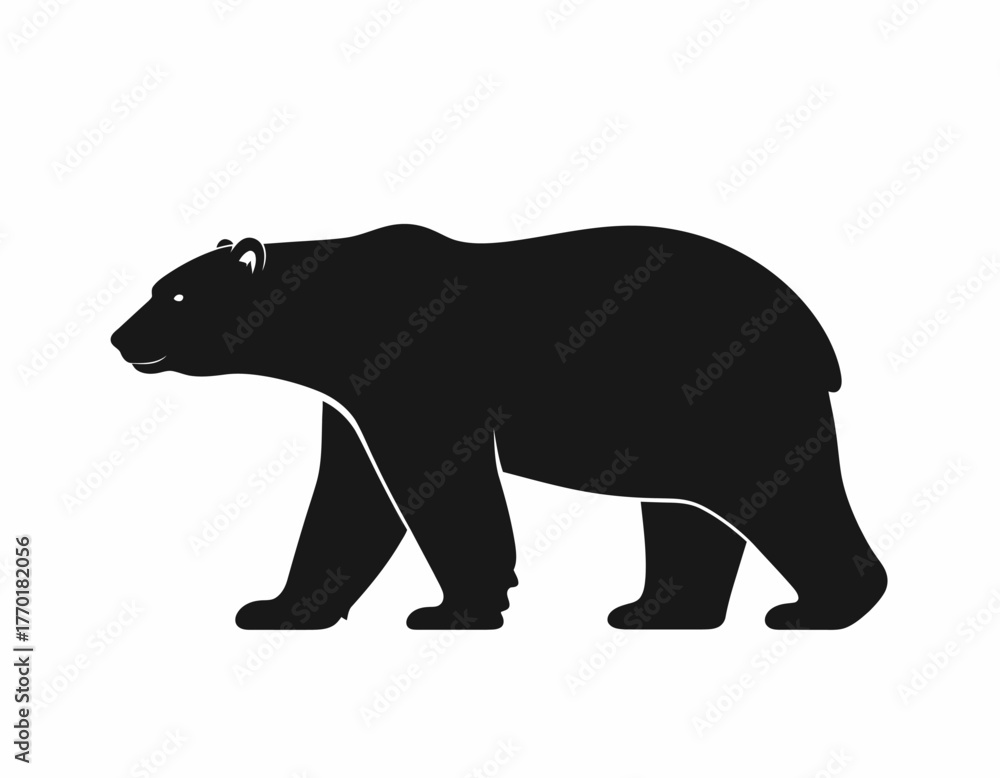 Fototapeta premium A black silhouette of a bear walking with its head and body visible.