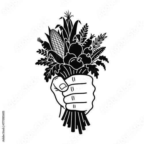 Hand holding bouquet of fresh harvest vegetables