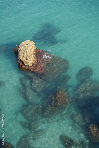 Turquoise Sea with Submerged Rocks from Above, Clear Coastal Water