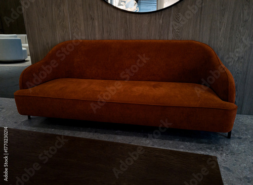 Modern orange textile sofa on in room