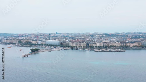 Aerial view of the iconic Bains des Pâquis pier extending into the serene waters, Geneva, Switzerland.